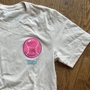 Cream T-Shirt with Pink Baseball Design. Baseballism double and bubbles